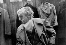 Edward with clock, off Cheshire Street Market, 1983