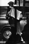 accordionist in front of van